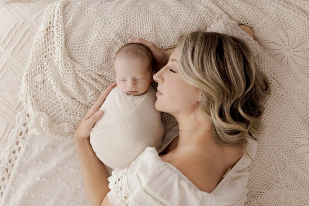 Expectant working mother planning newborn photography session during maternity leave in Akron