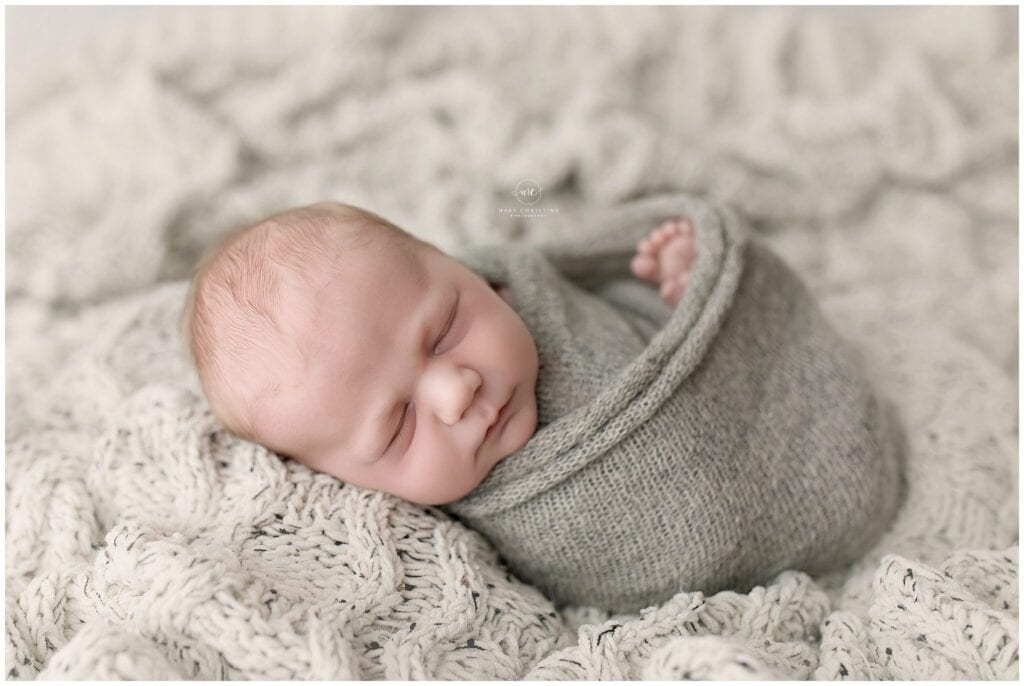 Peaceful newborn baby portrait taken at boutique photography studio in Akron Ohio