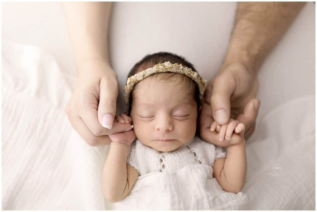 Newborn baby milestone photography setup with monthly blanket in Medina Ohio