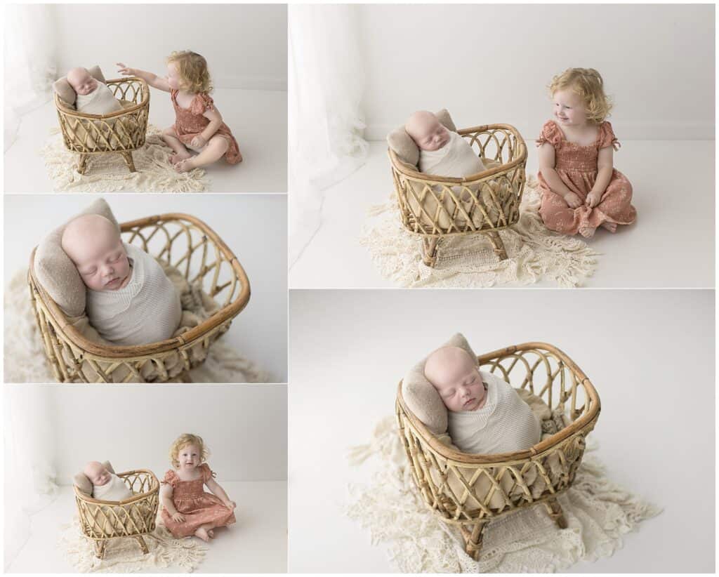 Tiny newborn sleeping in a wicker bassinet with a young girl sitting nearby, both in soft natural light, capturing timeless newborn and sibling photography, Mary Christine Photography.