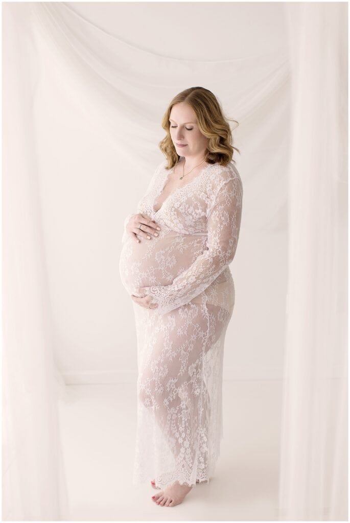 Expecting mother getting professional hair and makeup done during Cleveland studio maternity photo session