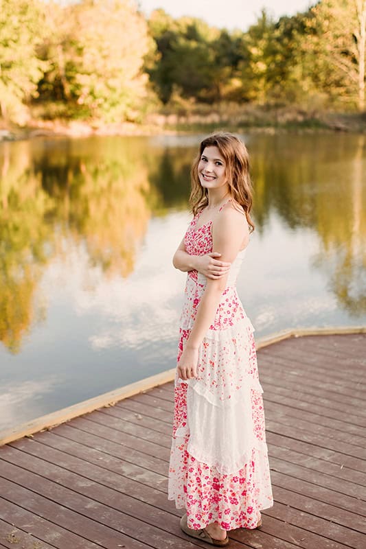 Soft, natural senior photo outfit with flowy dress