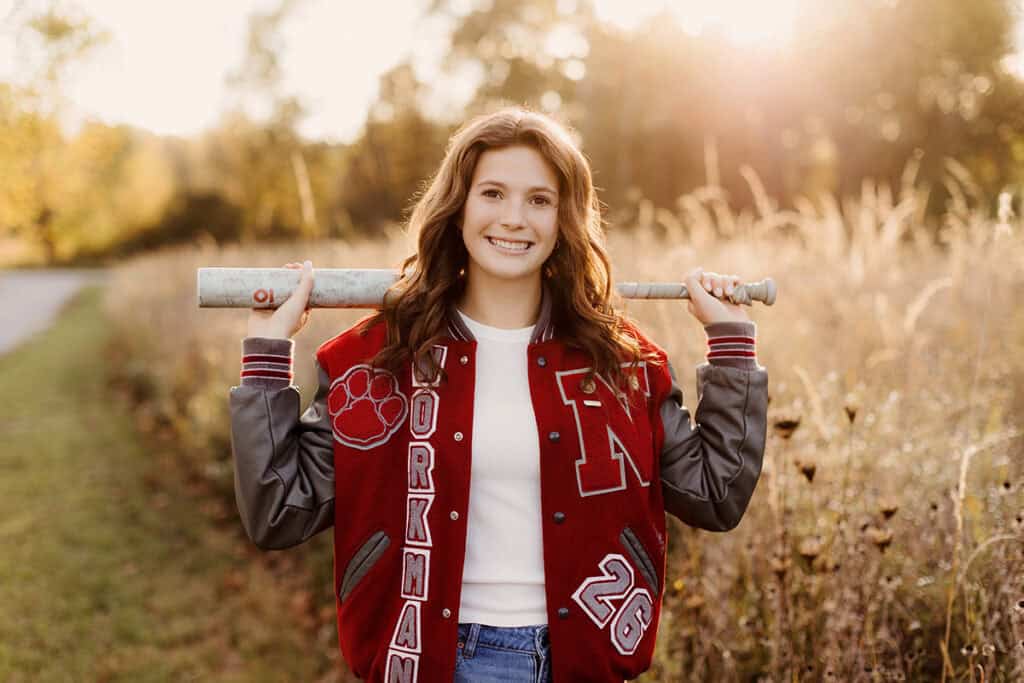 High school senior girl holding a bat during her Medina Ohio senior session.