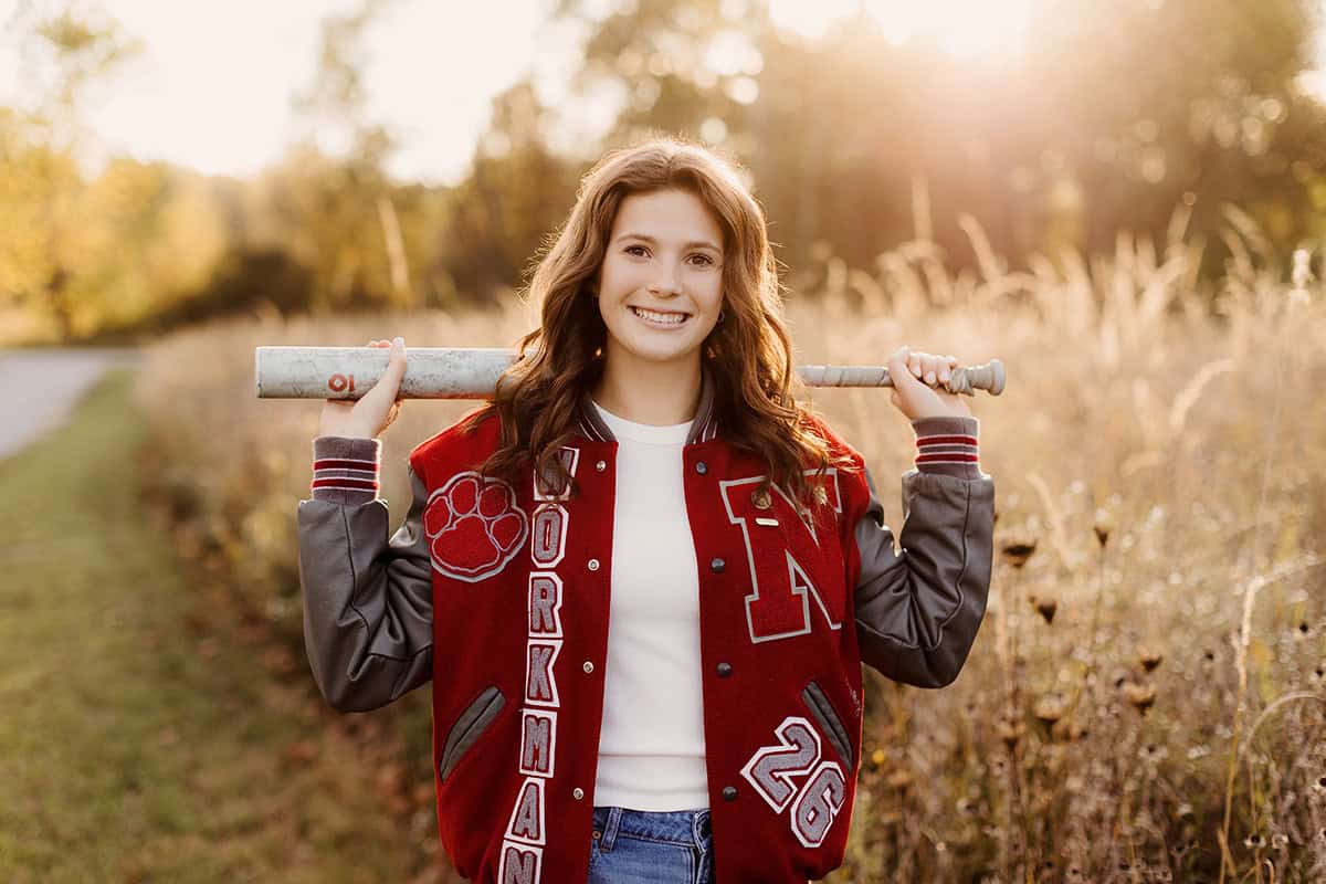 High school senior girl holding softball bat during her Medina Ohio senior session.