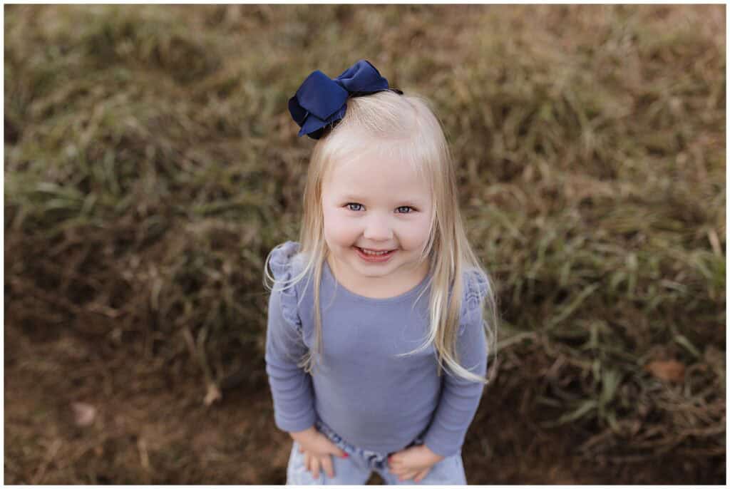 Little girl smiling during outdoor family photo session in Brunswick Ohio