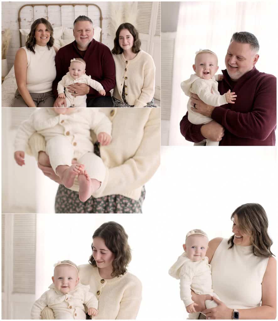 Family baby milestone session in a photography studio with neutral clothing that keeps the focus on expression.
