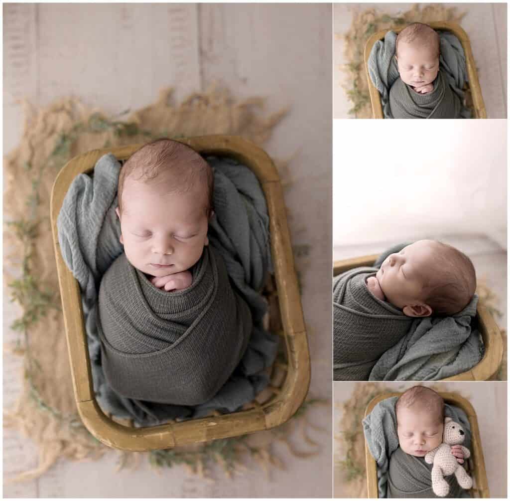 studio newborn photography in Cleveland Ohio with baby boy in green wrap and wooden bed prop