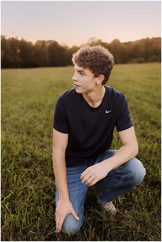 Confident high school senior smiling during a professionally guided senior portrait session