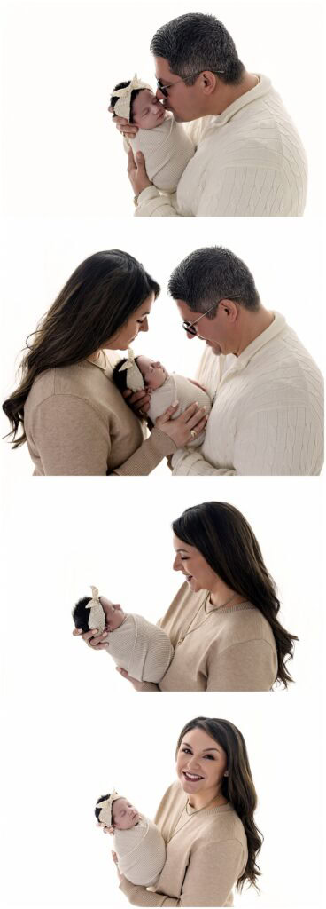 Father holding newborn baby girl in light and airy Medina Ohio photography studio