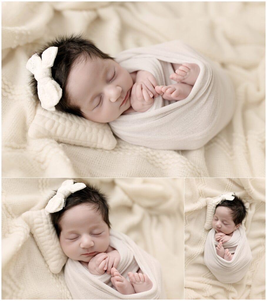 Newborn baby girl wrapped in cream tones during studio session in Medina Ohio