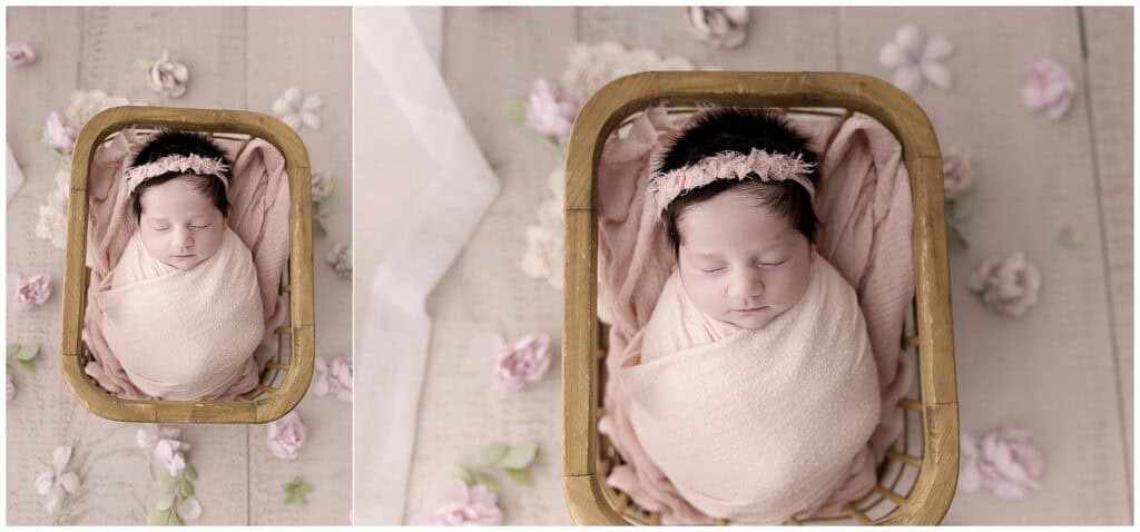 Newborn baby girl wrapped in blush tones with soft florals in Medina Ohio studio