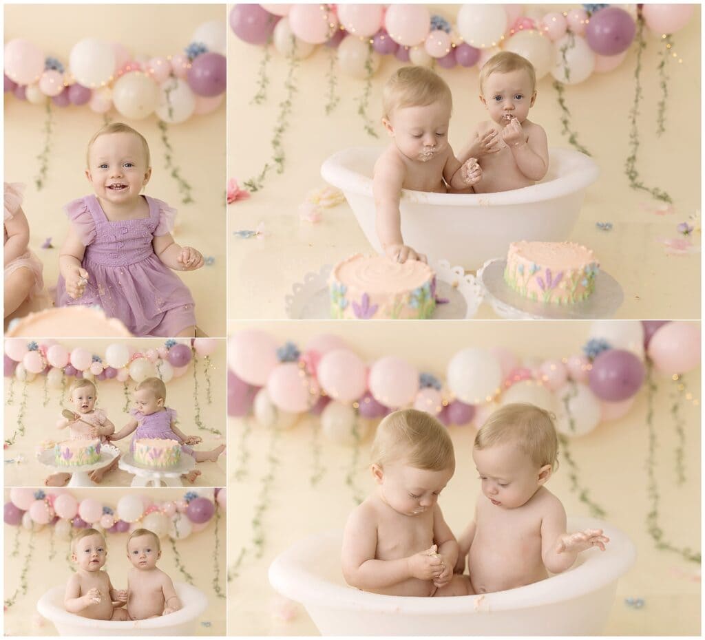 twin girls exploring their first birthday cakes during cake smash session