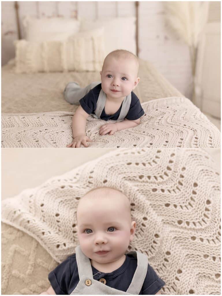 Baby boy in blue overalls during a soft neutral sitter session in Medina Ohio