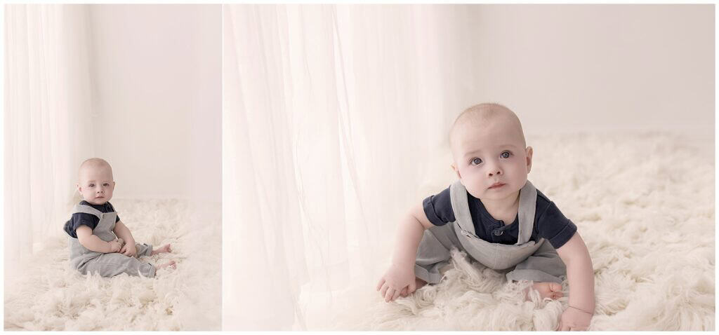 Baby boy sitting on a soft cream rug during a neutral studio milestone session